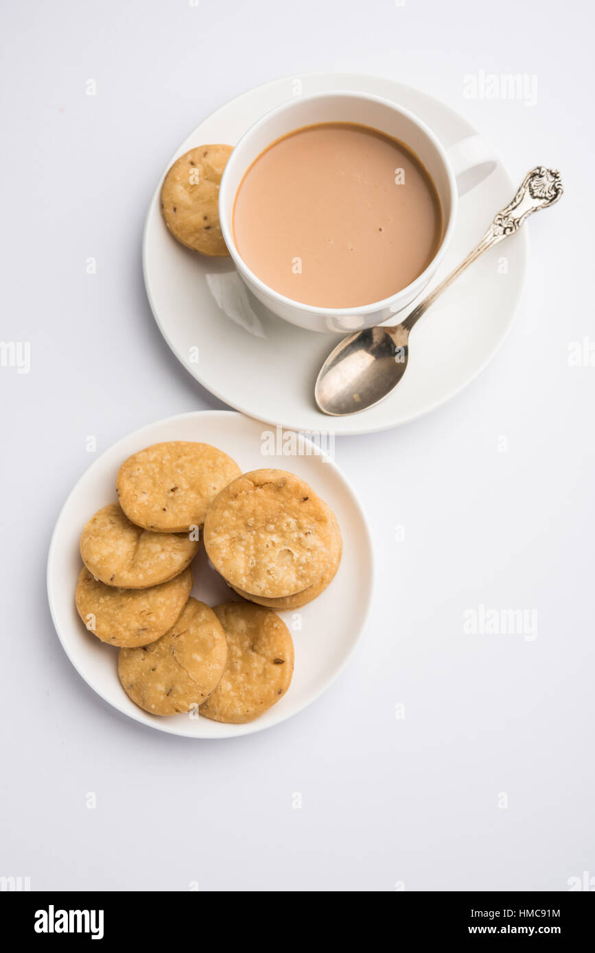 spicy fried mathri or mathari which is an indian snack served with a ...