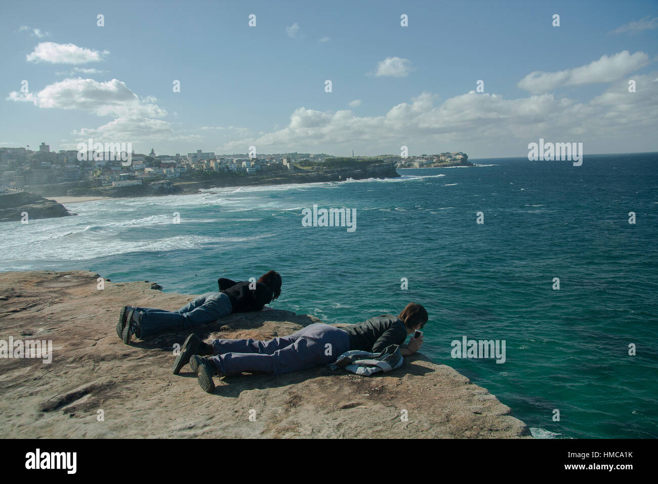 two people looking over clifftop, seascape, landscape, Australia Stock Photo