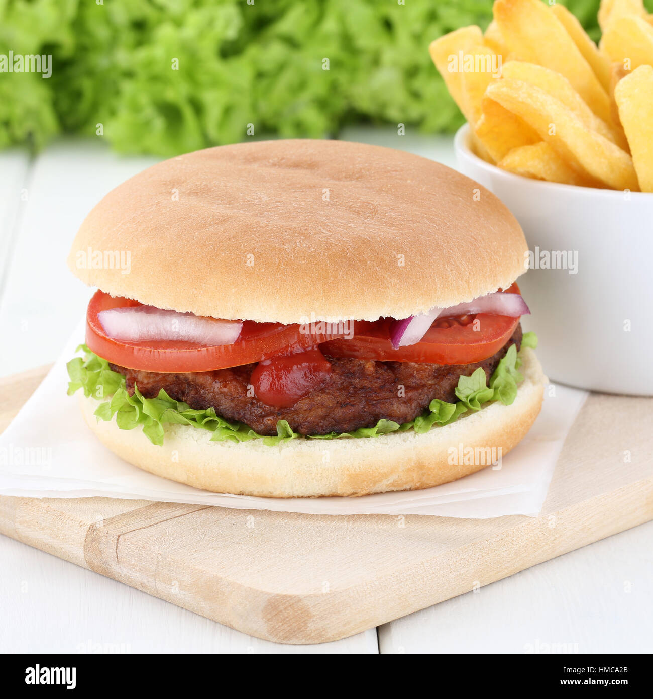 Hamburger and fries beef tomatoes lettuce unhealthy eating Stock Photo