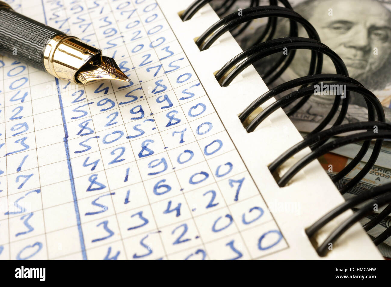 Note with financial data and cash. Accounting concept. Stock Photo