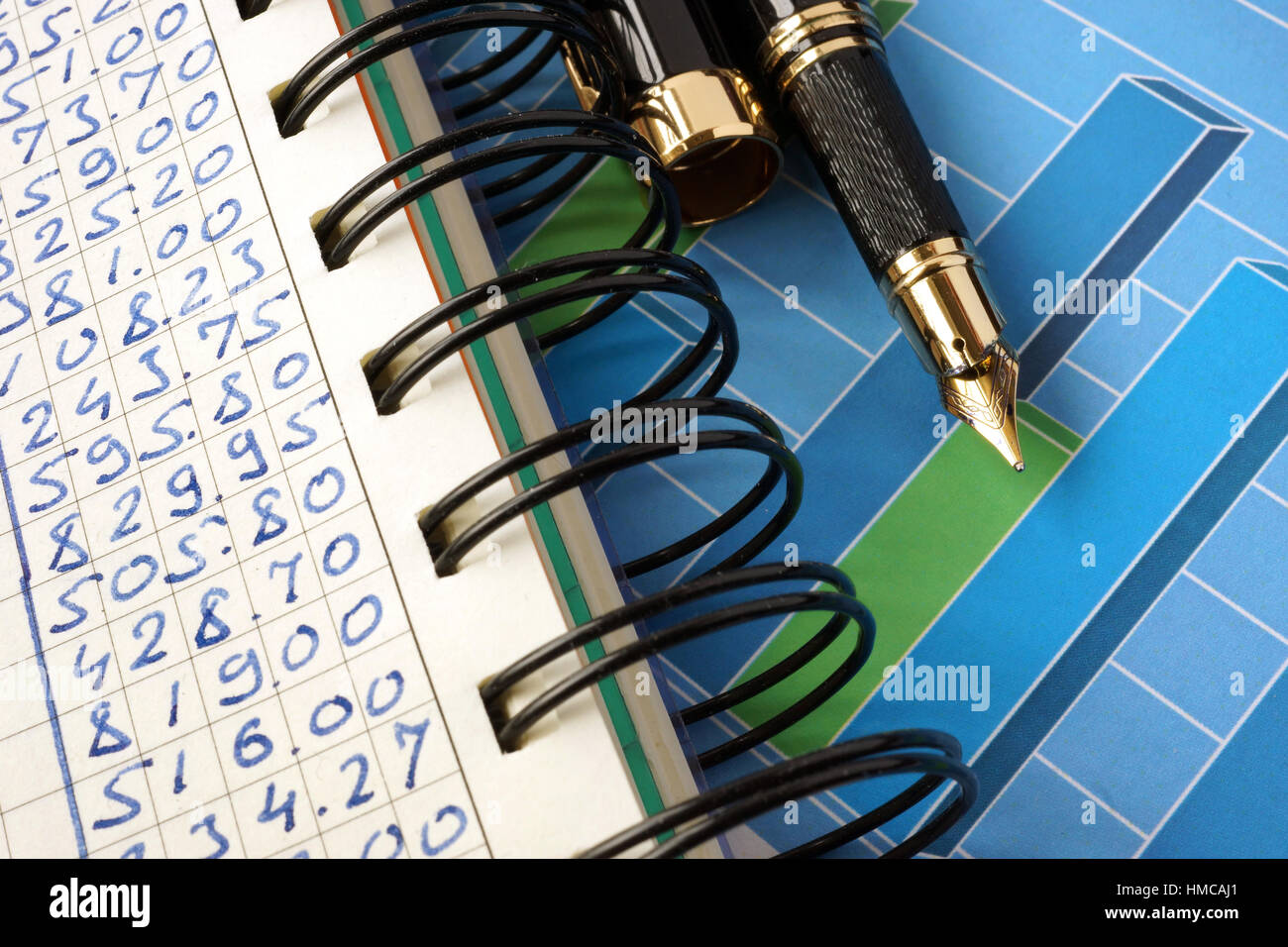 Financial graphs on a wooden surface. Business concept. Stock Photo