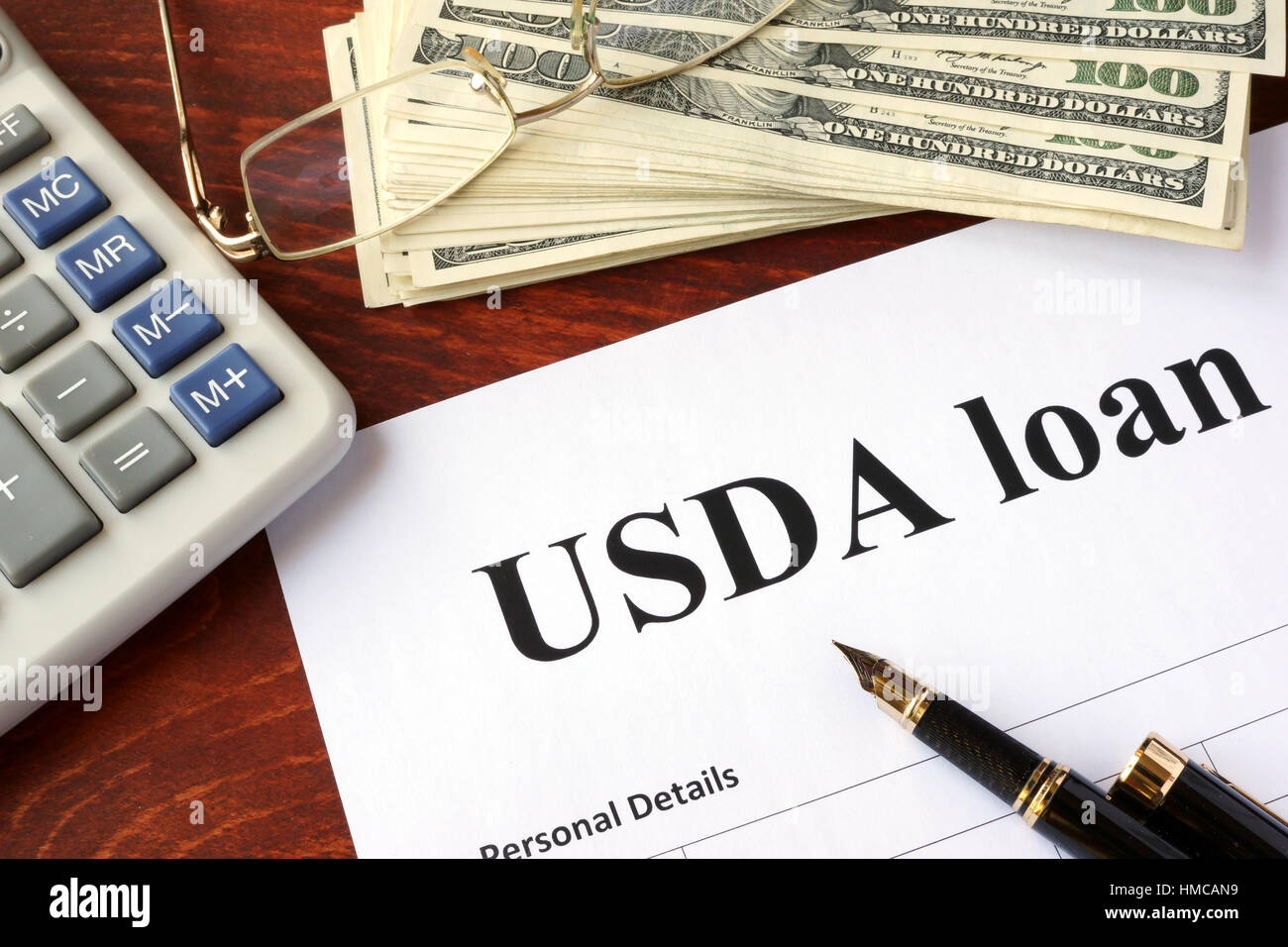 USDA loan form and documents on a table. Stock Photo