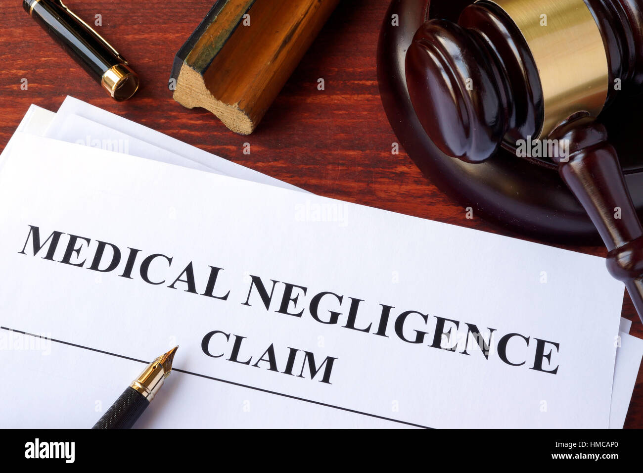 Medical Negligence claim  and gavel on a table. Stock Photo