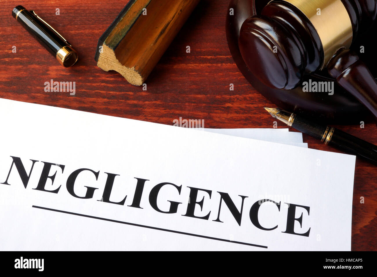 Negligence form, documents and gavel on a table. Stock Photo