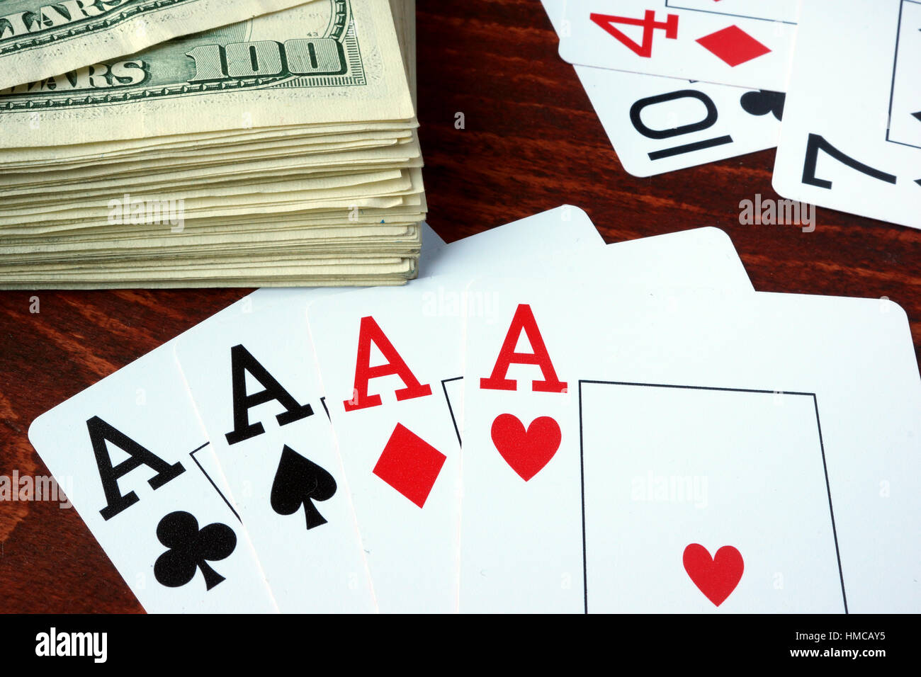 Four aces and dollar banknotes. Gambling concept. Stock Photo