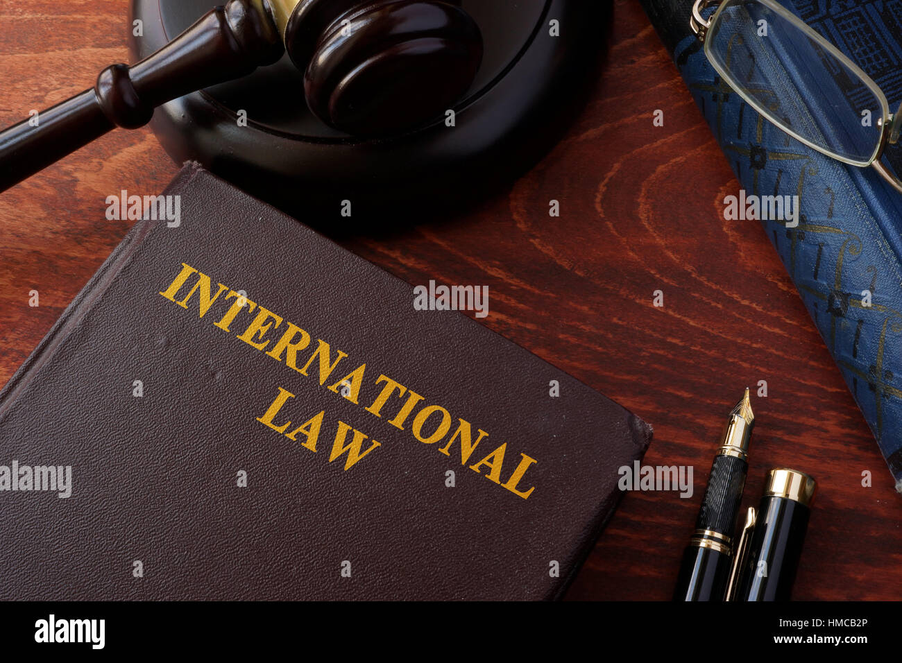 Book with title International law and a gavel. Stock Photo