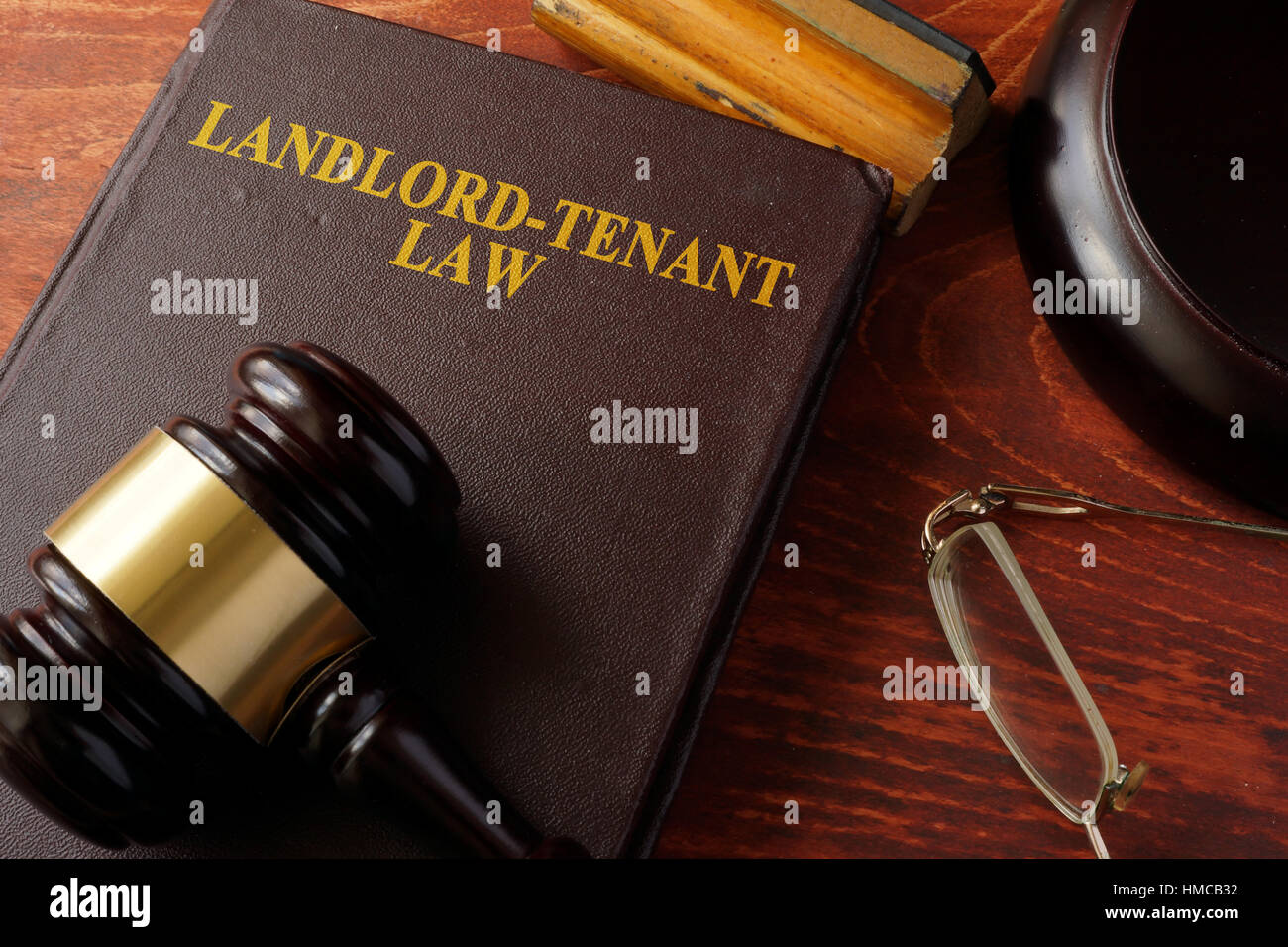 Book with title Landlord-Tenant Law and a gavel. Stock Photo