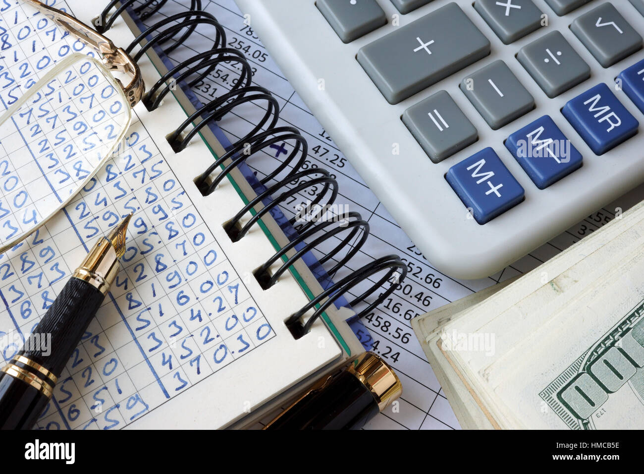 Ledger, calculator and money. Business concept. Stock Photo