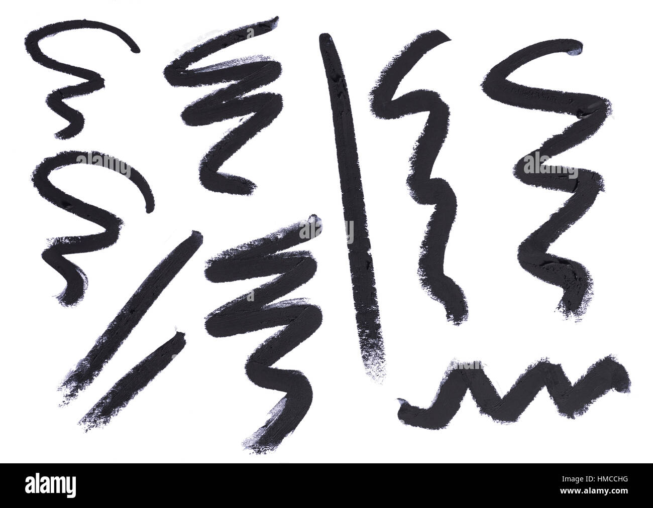 A cut out beauty image of a sample of black make up pencil or eye liner squiggles,lines or zig zag shapes Stock Photo