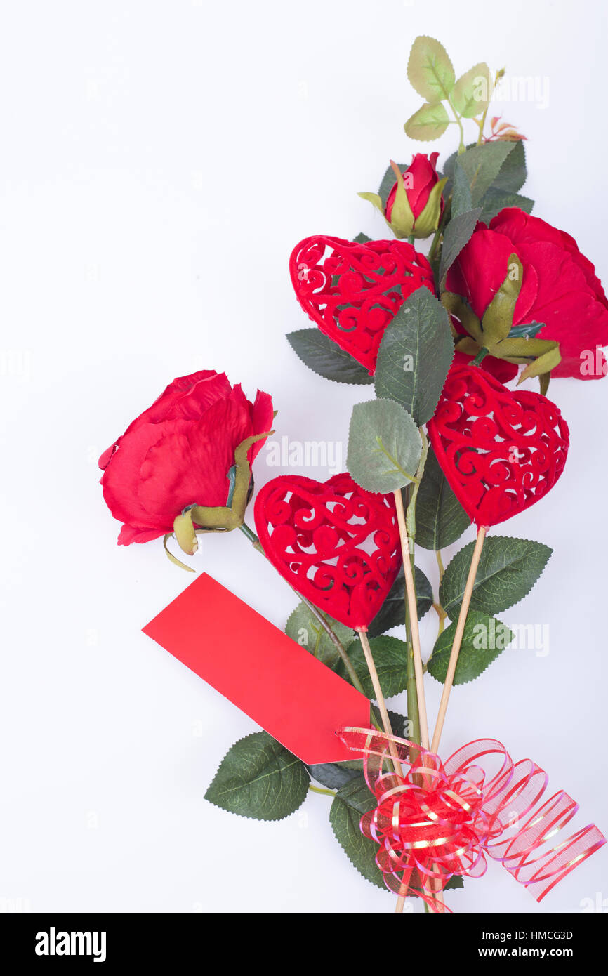 Red roses and red hearts on a white background Stock Photo - Alamy