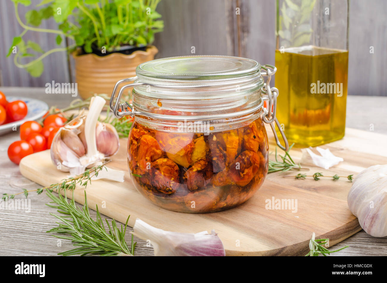 Homemade sun dried tomatoes, with olive oil, garlic and herbs, dried in