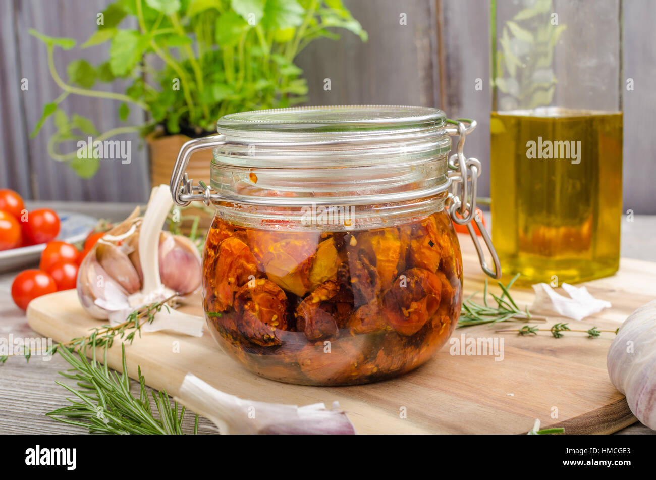 Homemade sun dried tomatoes, with olive oil, garlic and herbs, dried in