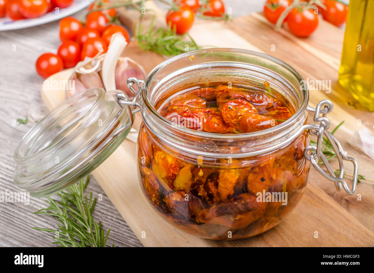 Homemade sun dried tomatoes, with olive oil, garlic and herbs, dried in