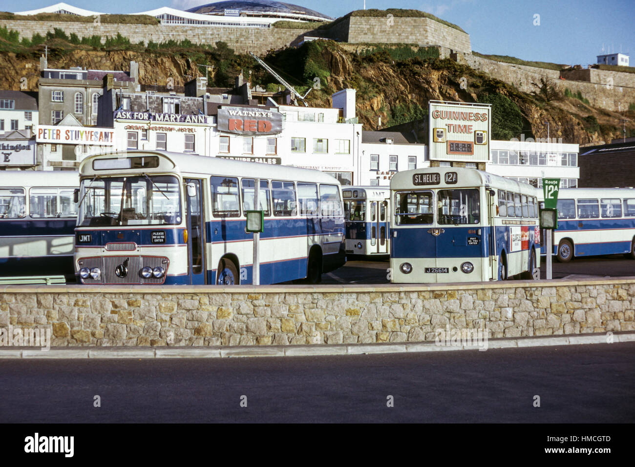 Jersey, Channel Islands - 1973: Vintage image of buses in St Helier, Jersey.  Jersey Motor Transport Leyland PSUC1/5 614 (registration J26614) and other  buses Stock Photo - Alamy