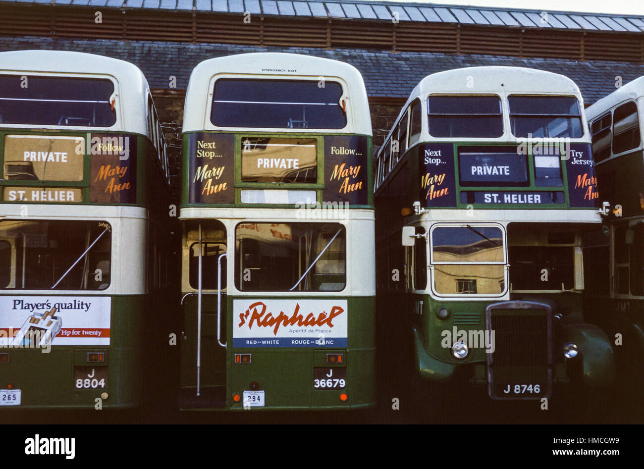 Jersey, Channel Islands - 1973: Vintage image of ex-London Transport Leyland buses in Jersey Motor Transport livery in St Helier, Jersey.  (registration numbers J8804, J36679, J8746). Stock Photo