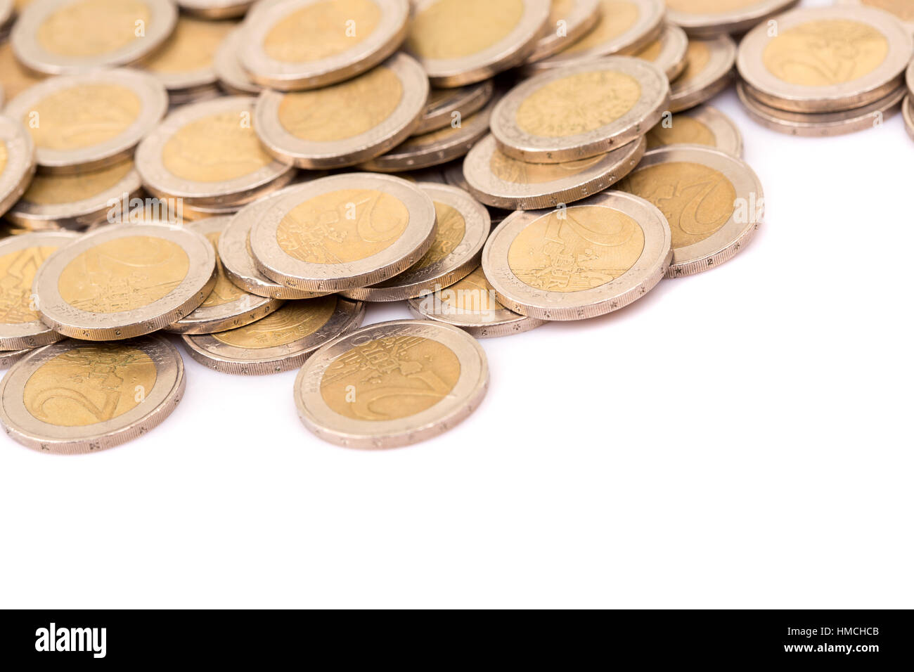Heap of two euro coins isolated on white background Stock Photo - Alamy