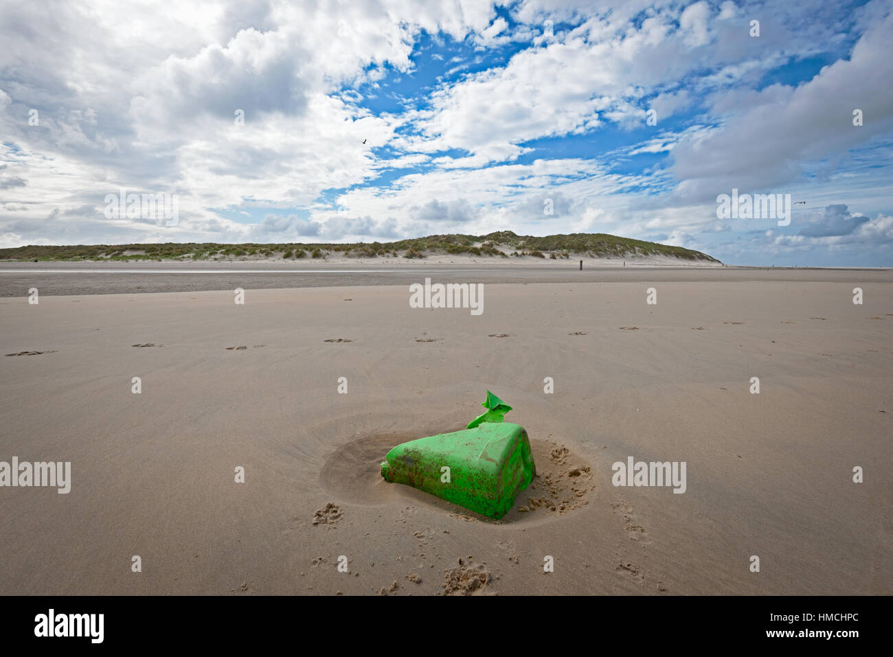 Green plastic garbage on the dutch beach of Vlieland Stock Photo