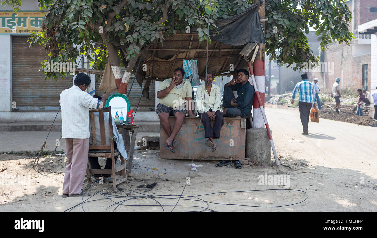 Three Indian men sitting in the shade waiting to have their hair cut in the street Stock Photo - Alamy Three Indian men sitting in the shade waiting to have their hair cut in the street Stock Photo - Alamy