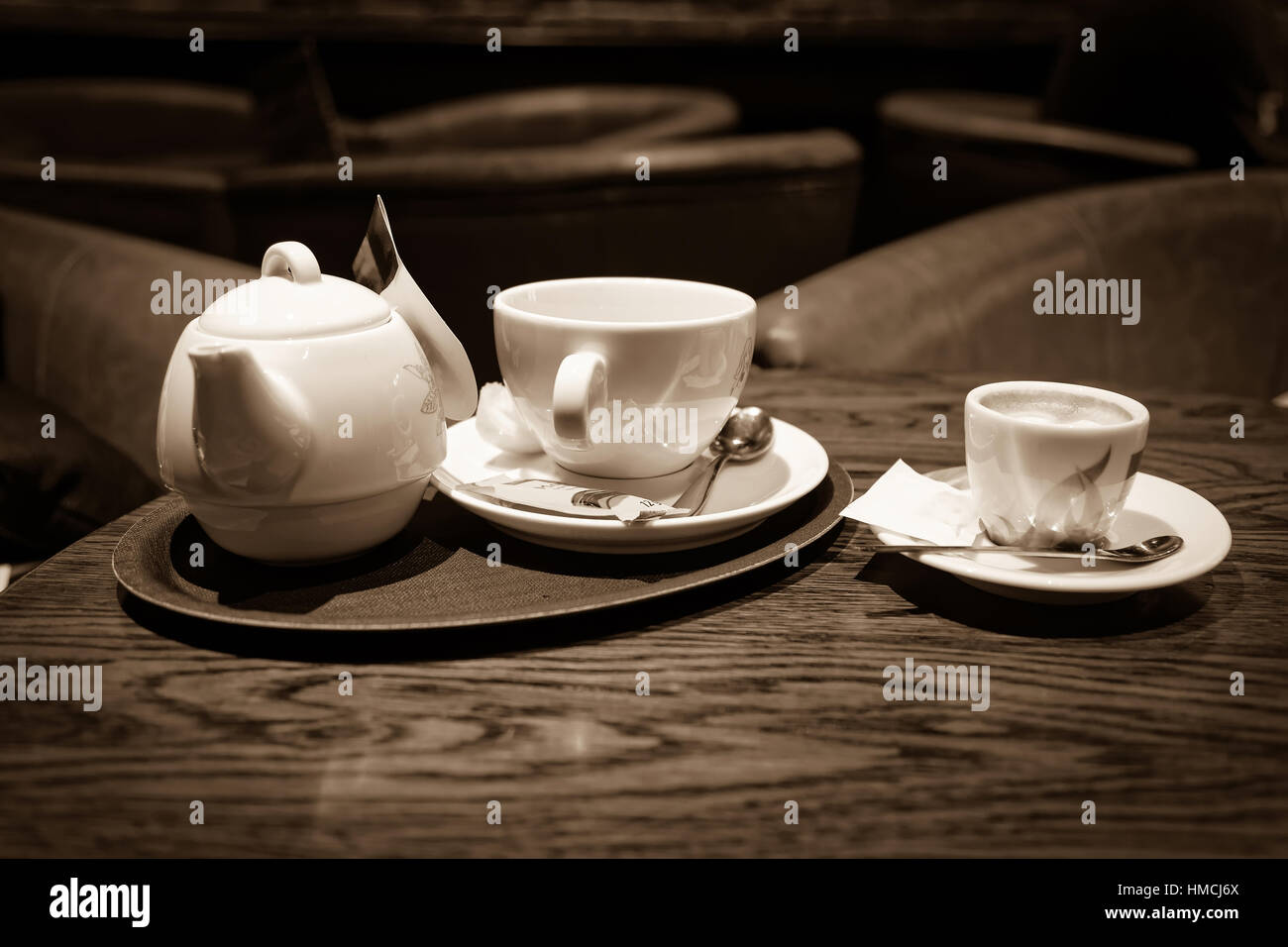 cup of coffee and tea on bar table, sepia toned Stock Photo