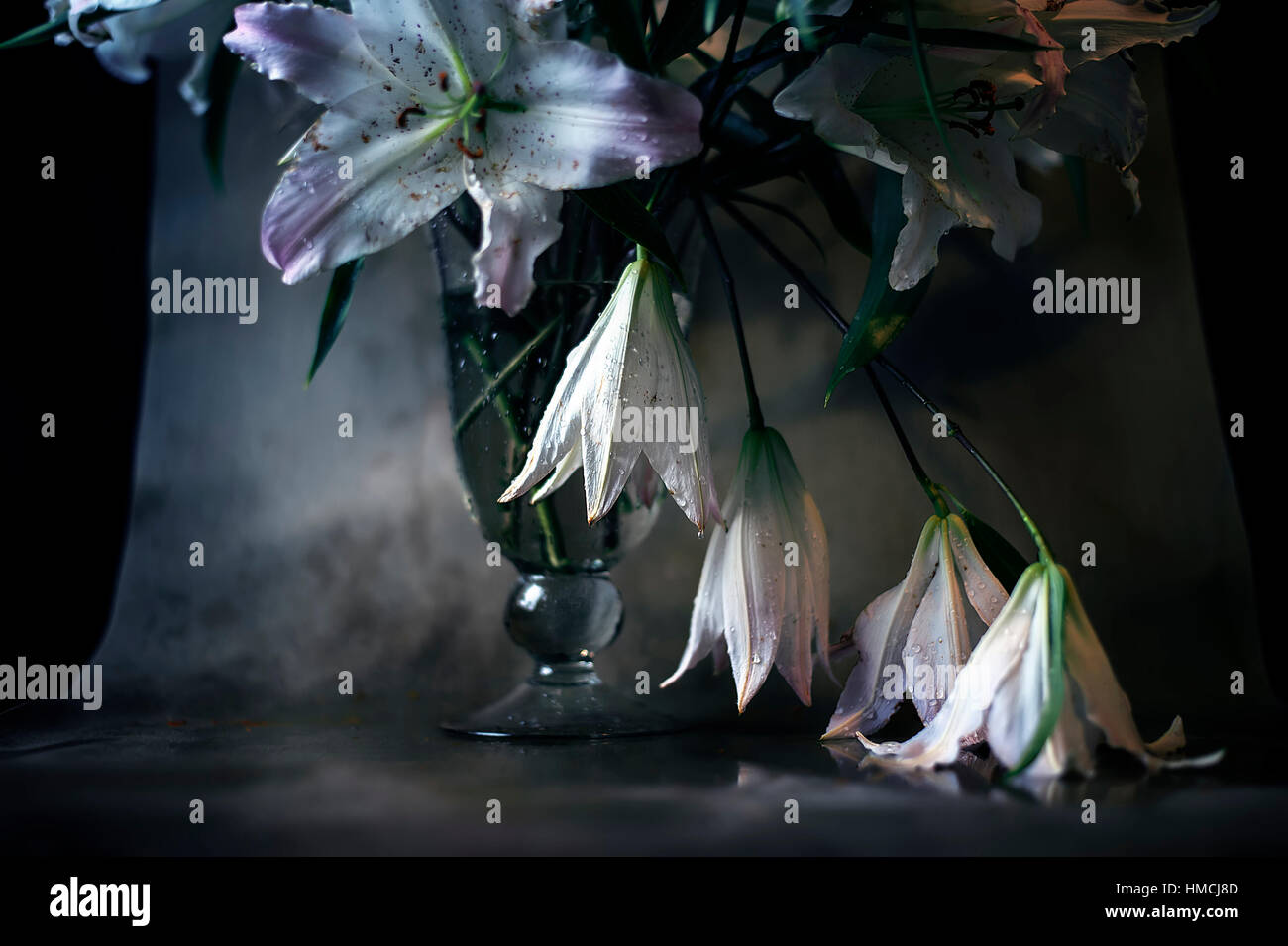 Bouquet of white lilies in glass vase Stock Photo - Alamy