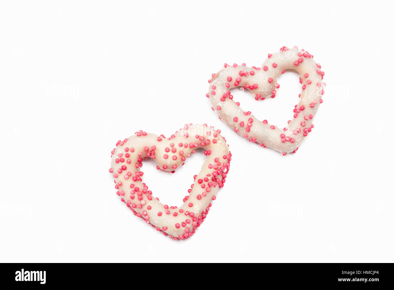 Two white chocolate covered pretzels Stock Photo