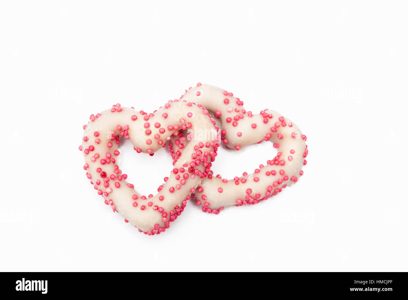 Two white chocolate covered pretzels Stock Photo
