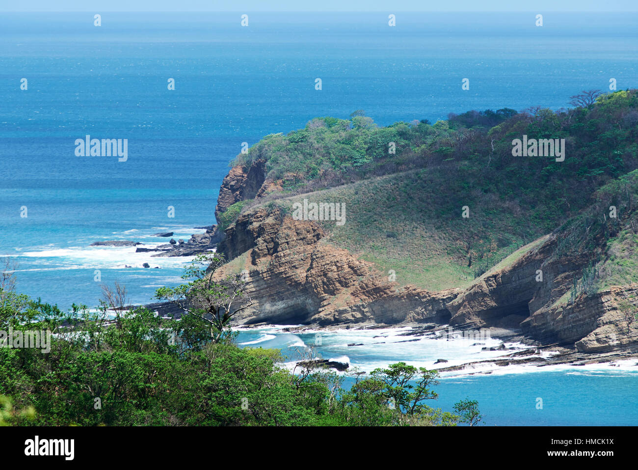 landscape of rock coast with blue sea water Stock Photo
