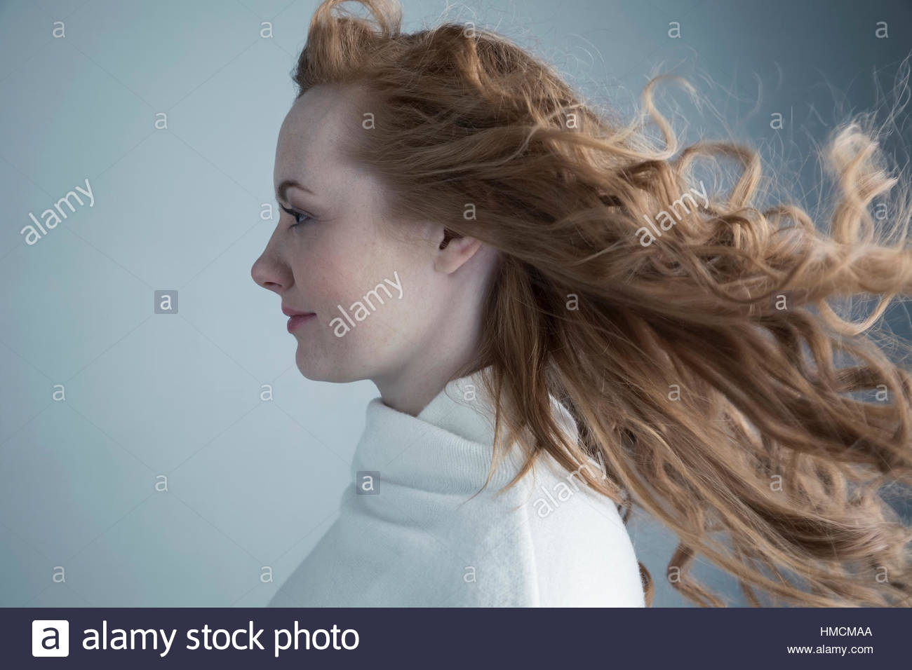 Woman long curly hair blowing hi-res stock photography and images - Alamy