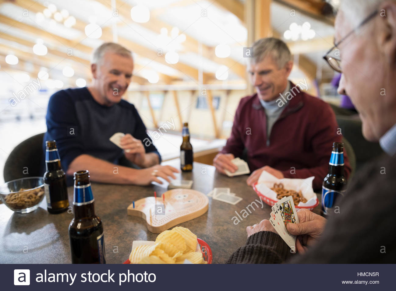 Senior men playing cribbage and drinking beer Stock Photo Alamy