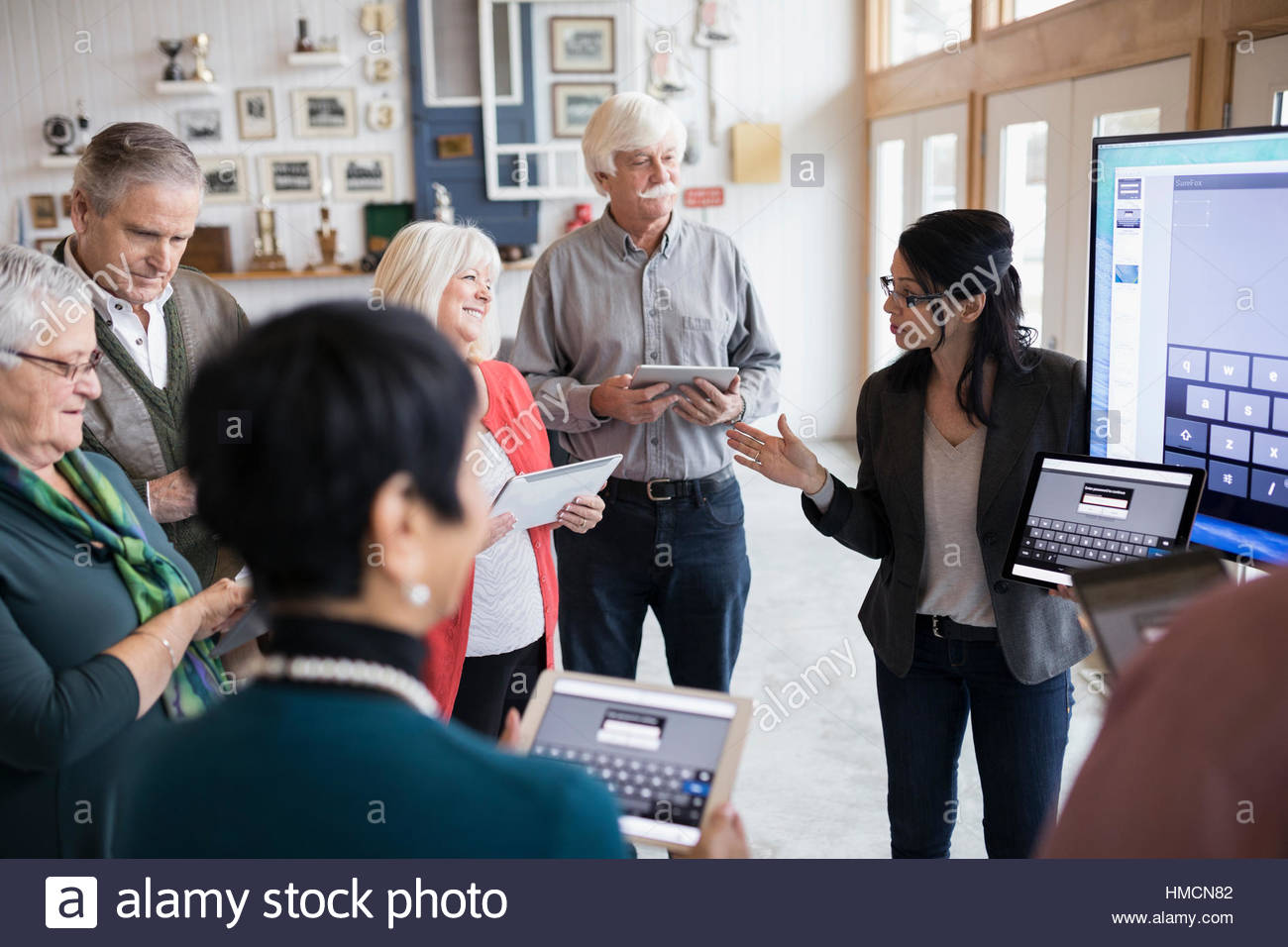 Senior students learning how to use digital tablets in classroom Stock Photo Alamy