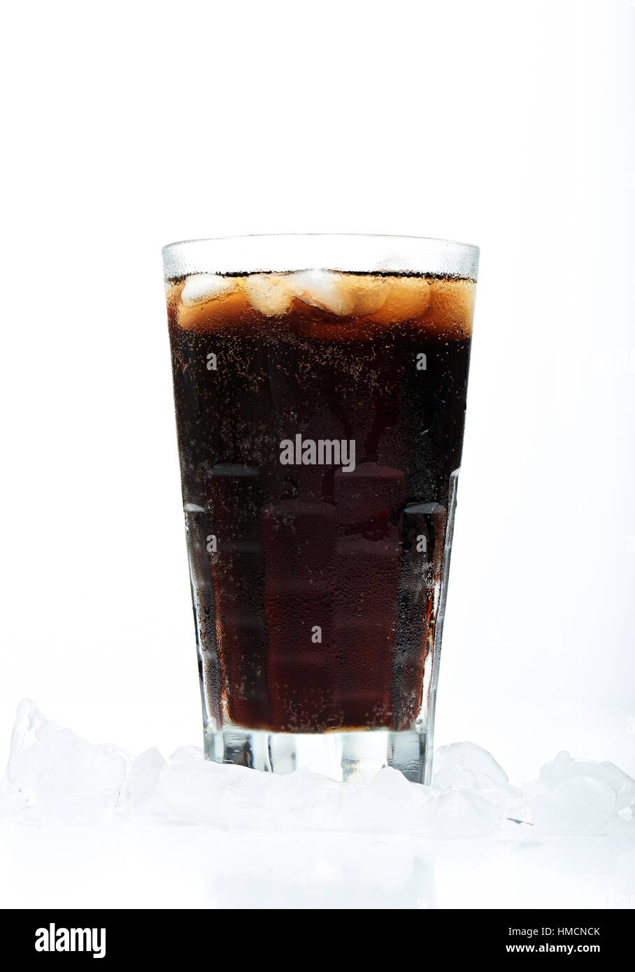 glass with soda in ice isolated on white background Stock Photo