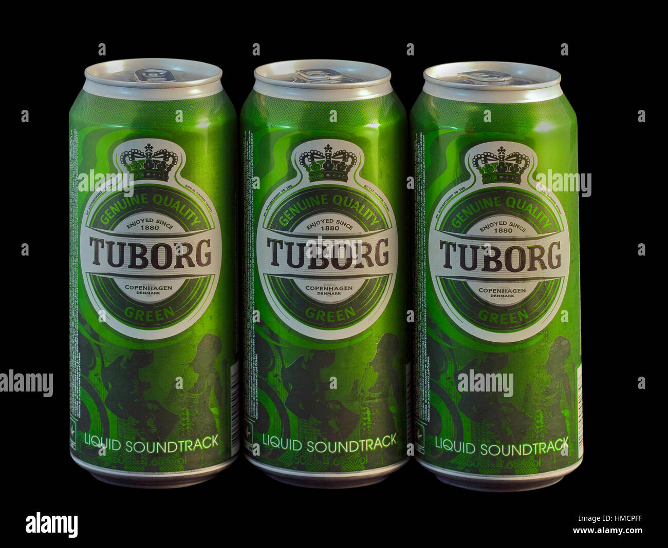 KIEV, UKRAINE - APRIL 09, 2011: Three wet Tuborg Green beer cans against black. Tuborg is a Danish brewing company founded in 1873 by Carl Frederik Ti Stock Photo