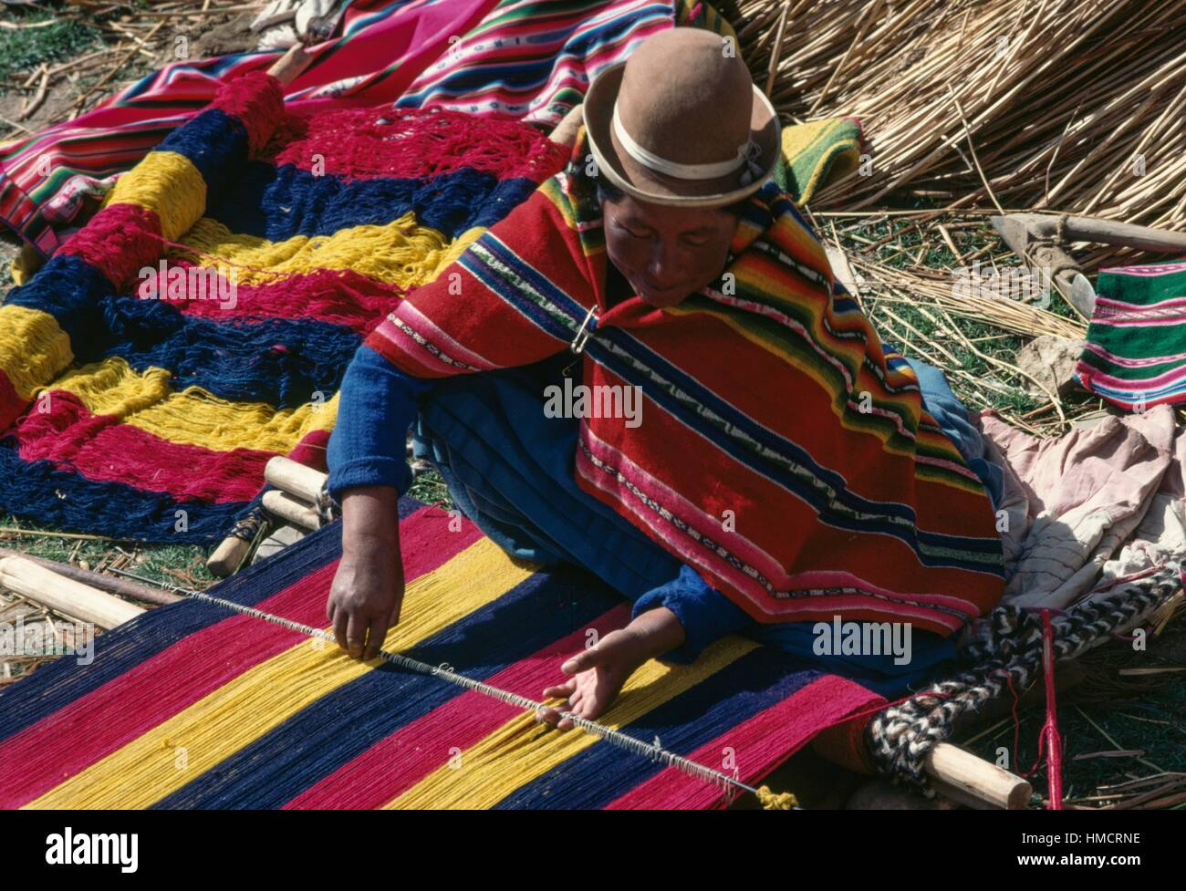 https://c8.alamy.com/comp/HMCRNE/bolivian-woman-wearing-traditional-woven-clothing-made-from-coloured-HMCRNE.jpg