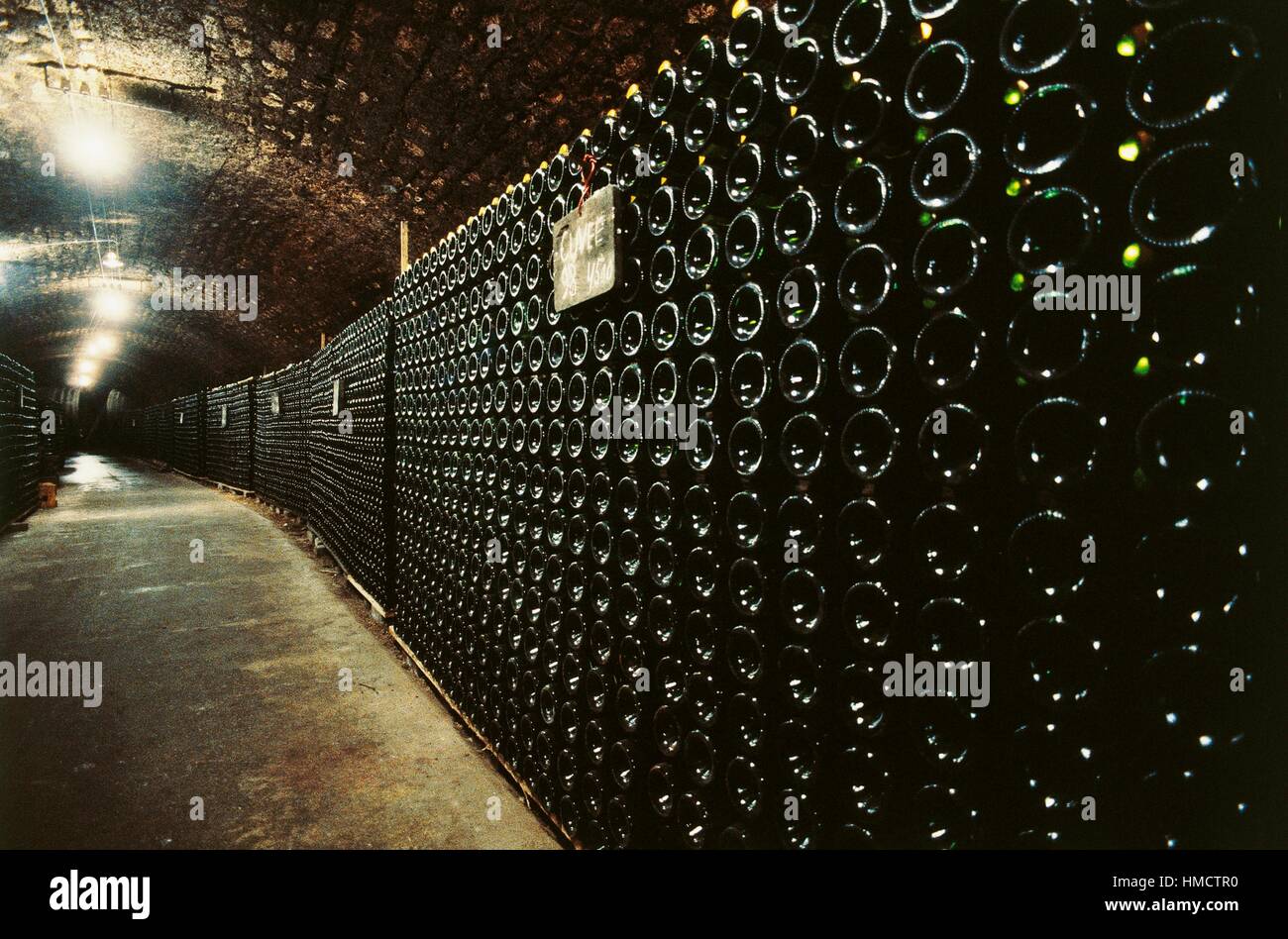 Cellar with bottles for aging Champagne, Remich, Grand Duchy of Luxembourg. Stock Photo