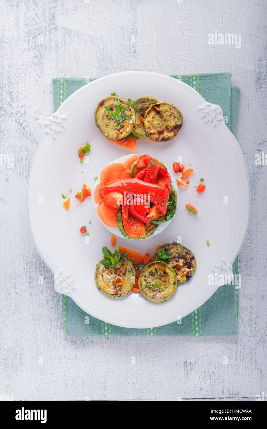 Rice timbale with fried zucchini, peppers, carrots Stock Photo Alamy
