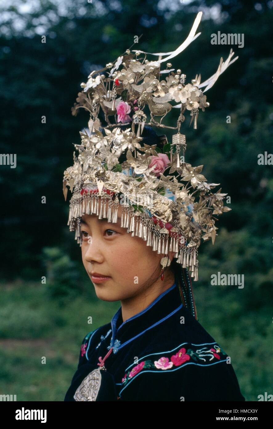 A girl wearing a traditional headdress, Miao people, China. Stock Photo
