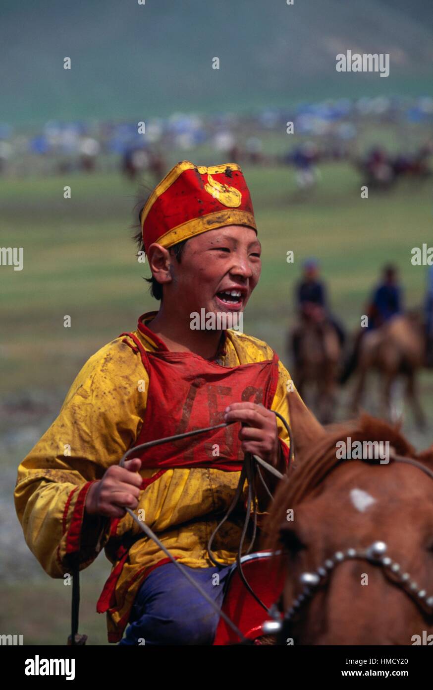 Boy Wearing Traditional Clothes During The Horse Race, Naadam Festival ...