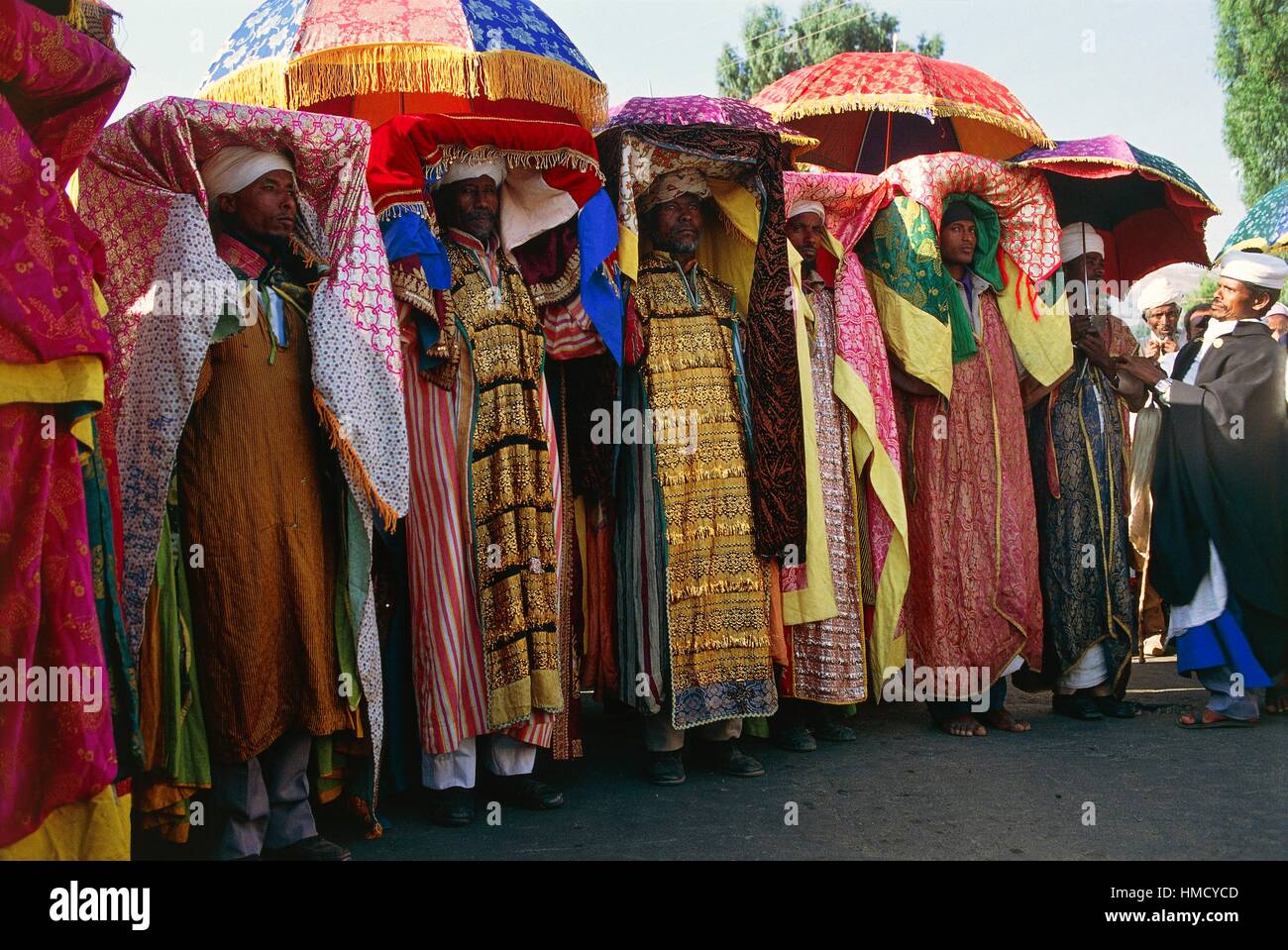 Priests with a tabot, tables of laws, and lavish fabrics covering their heads during the Timkat festival, Coptic Epiphany, Stock Photo