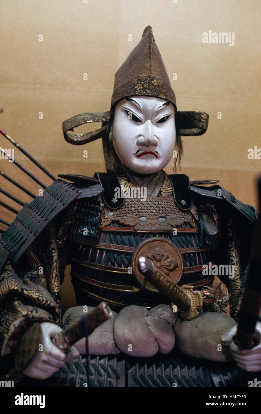 Samurai doll with helmet, weapons and armour, ceramic face, Kurashiki doll museum, Japan. Stock Photo