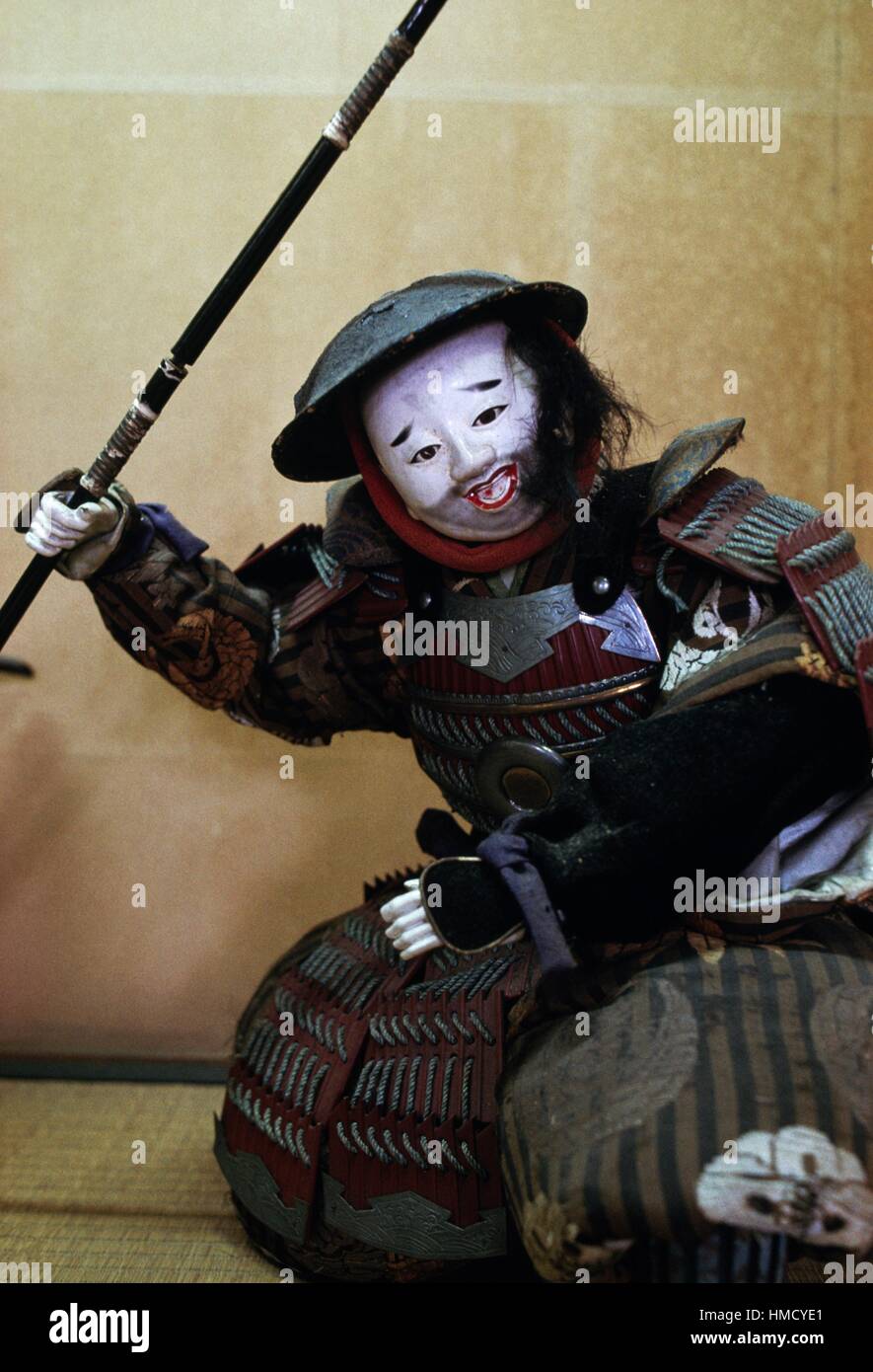 Samurai doll with helmet, weapons and armour, ceramic face, Kurashiki doll museum, Japan. Stock Photo