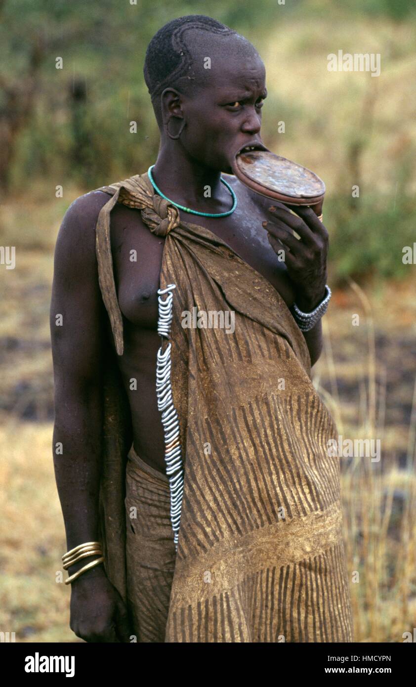 Young Mursi woman with a lip plate, Mago National Park, Ethiopia. Stock Photo