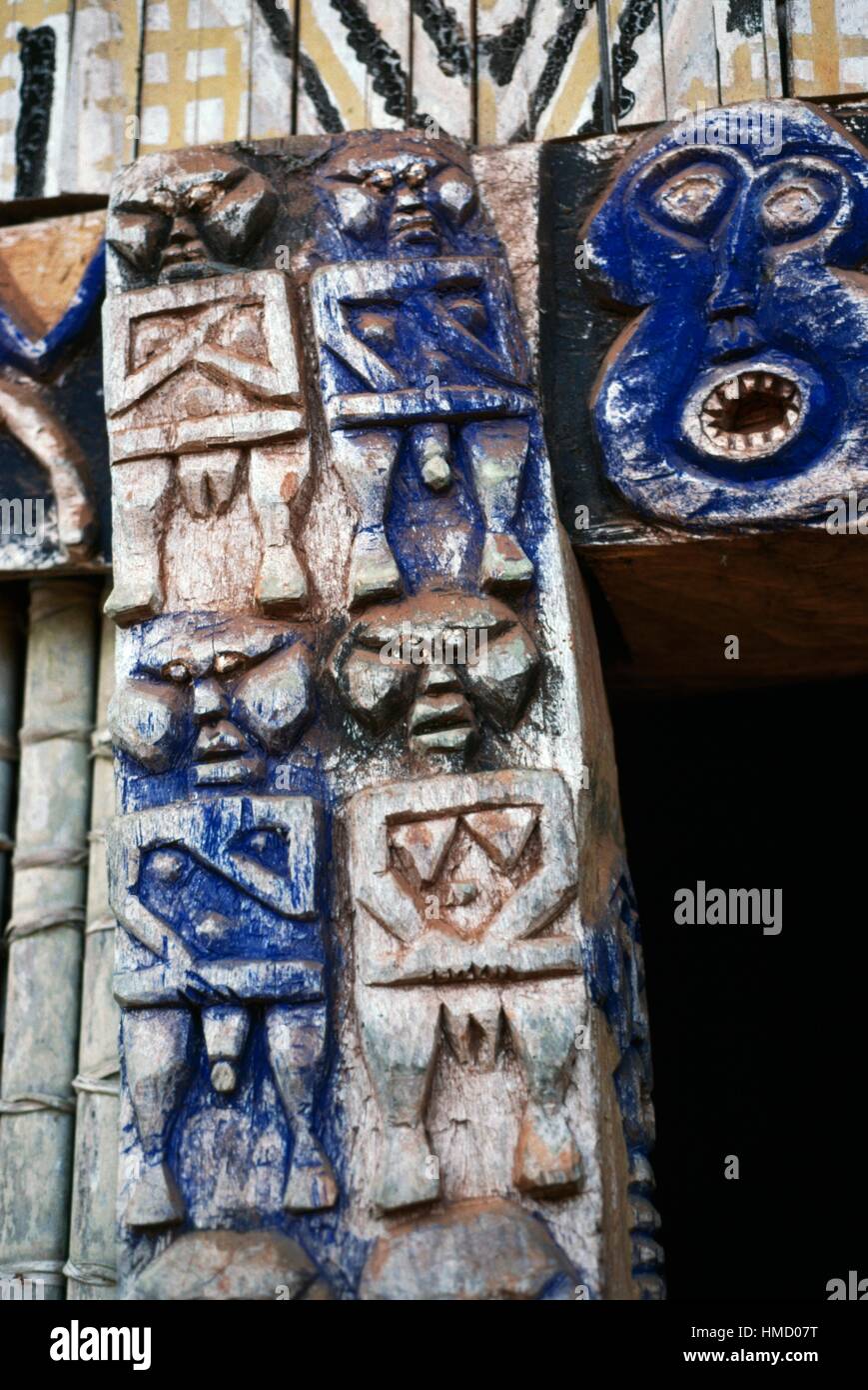 Grotesque figures, carved wood architectural decoration of a chefferie, home of the village chief, Bamileke people, Bandjoun, Stock Photo