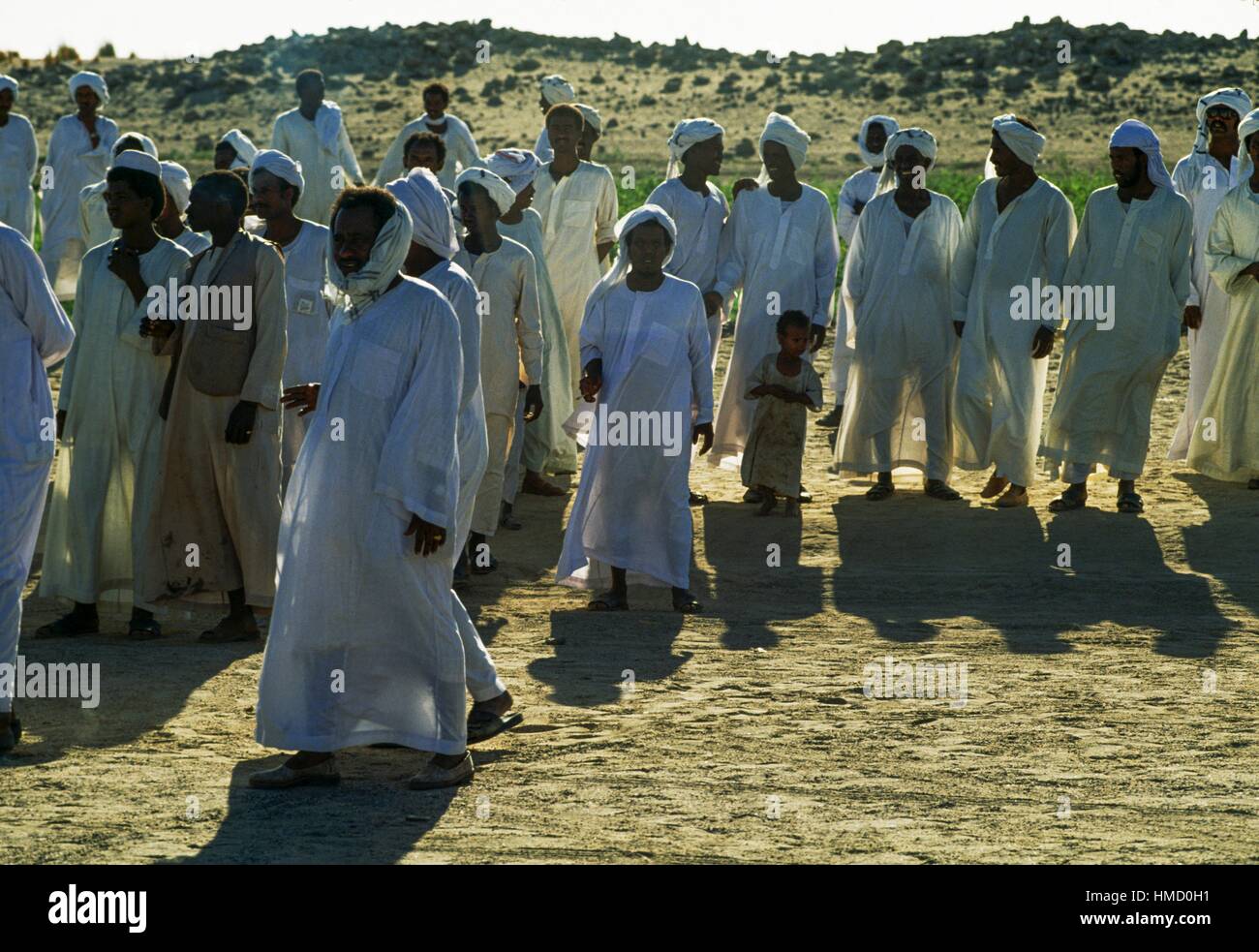 Group attending a wedding in white clothes, Kerma, Karmah, Nubia, Sudan. Stock Photo