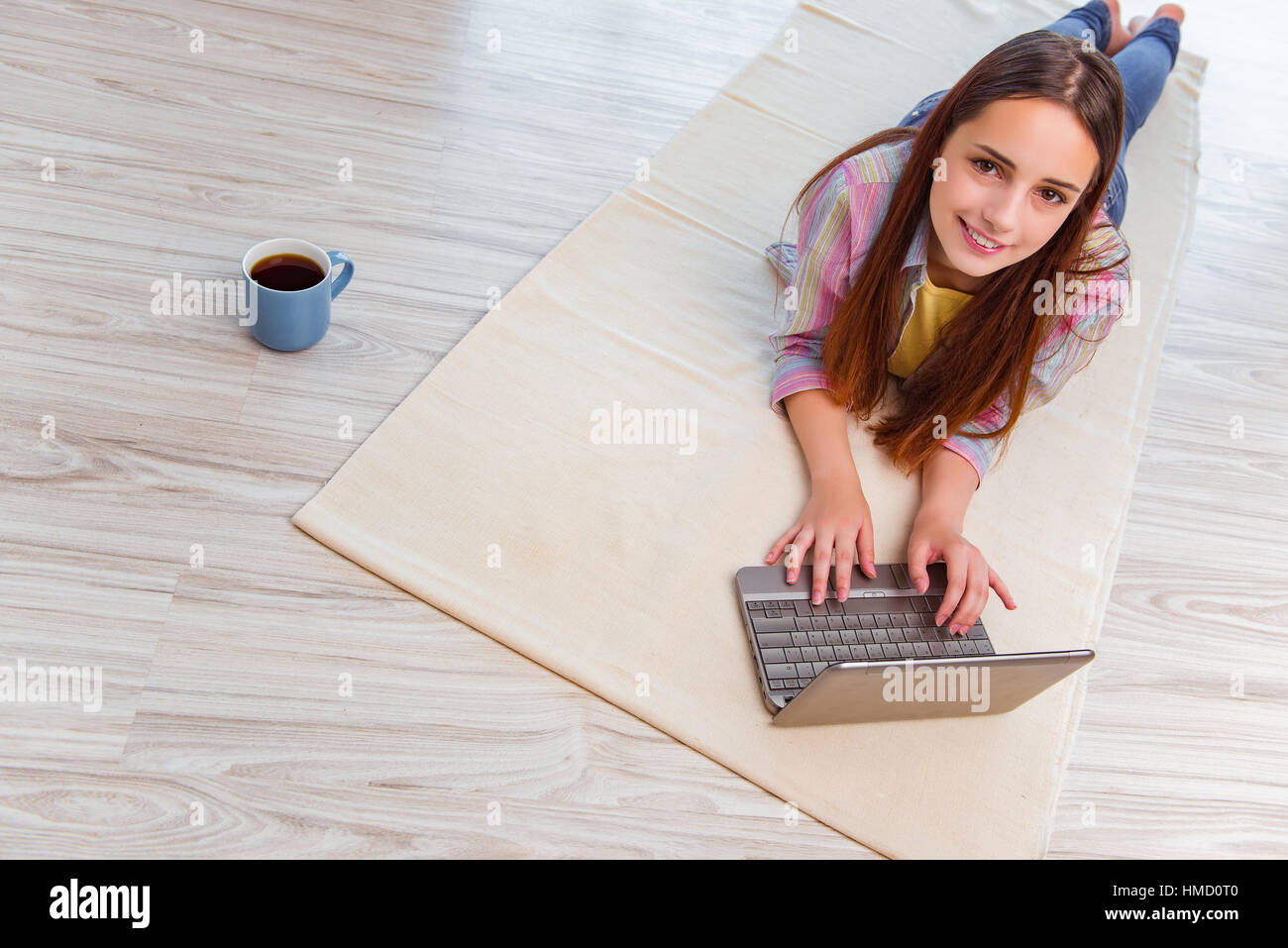 Young girl surfing internet on laptop Stock Photo - Alamy