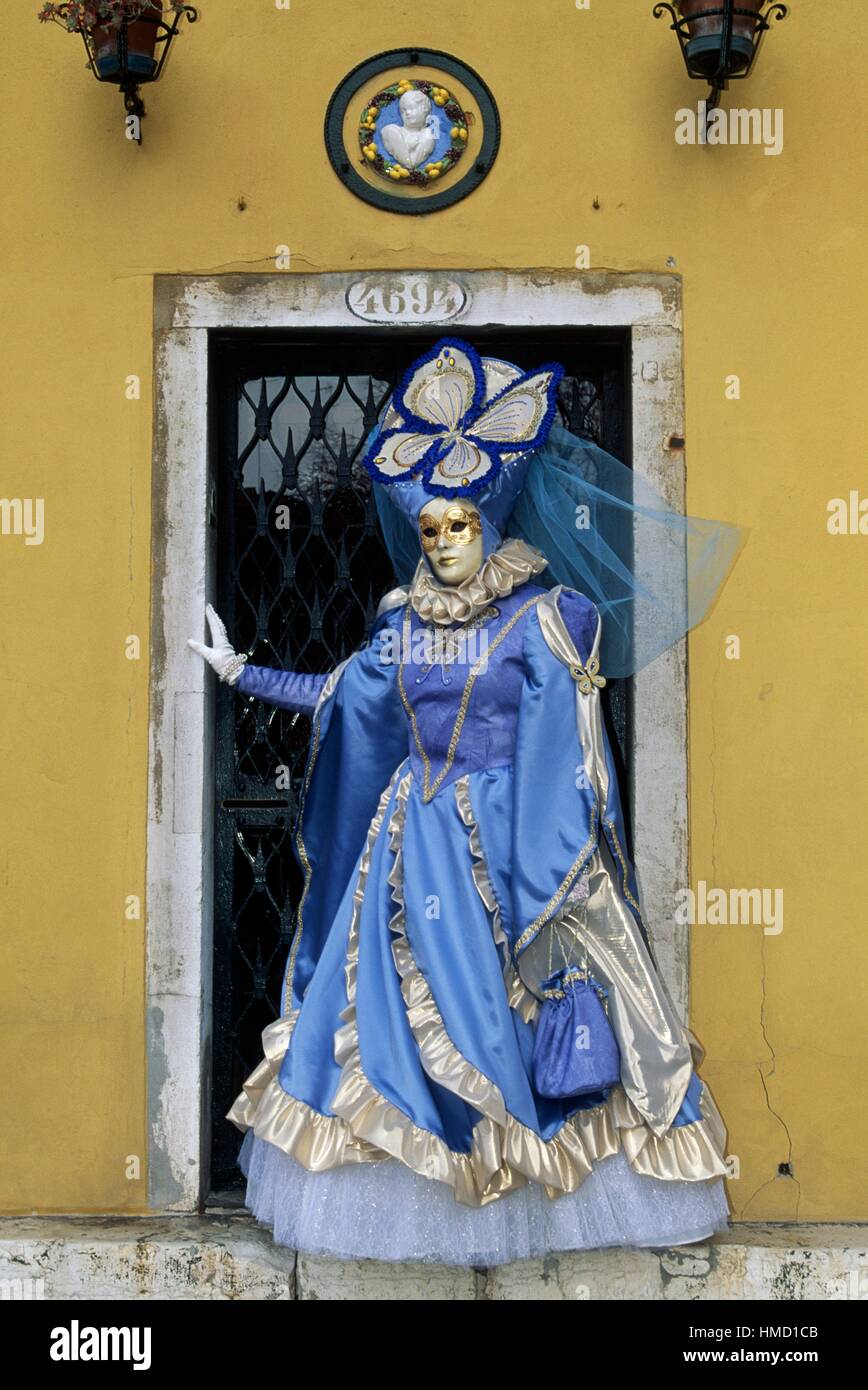 Person in costume with butterfly-shaped headdress, Venice carnival, Veneto, Italy. Stock Photo