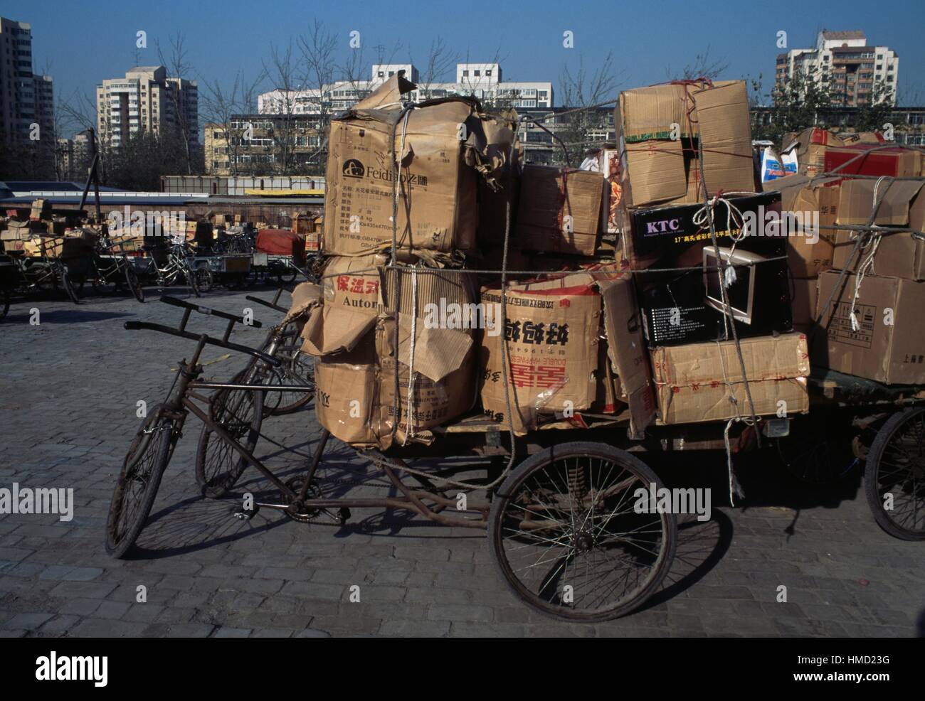 Bicycles with small carts loaded with cardboard boxes, Panjiayuan market, Beijing, China. Stock Photo