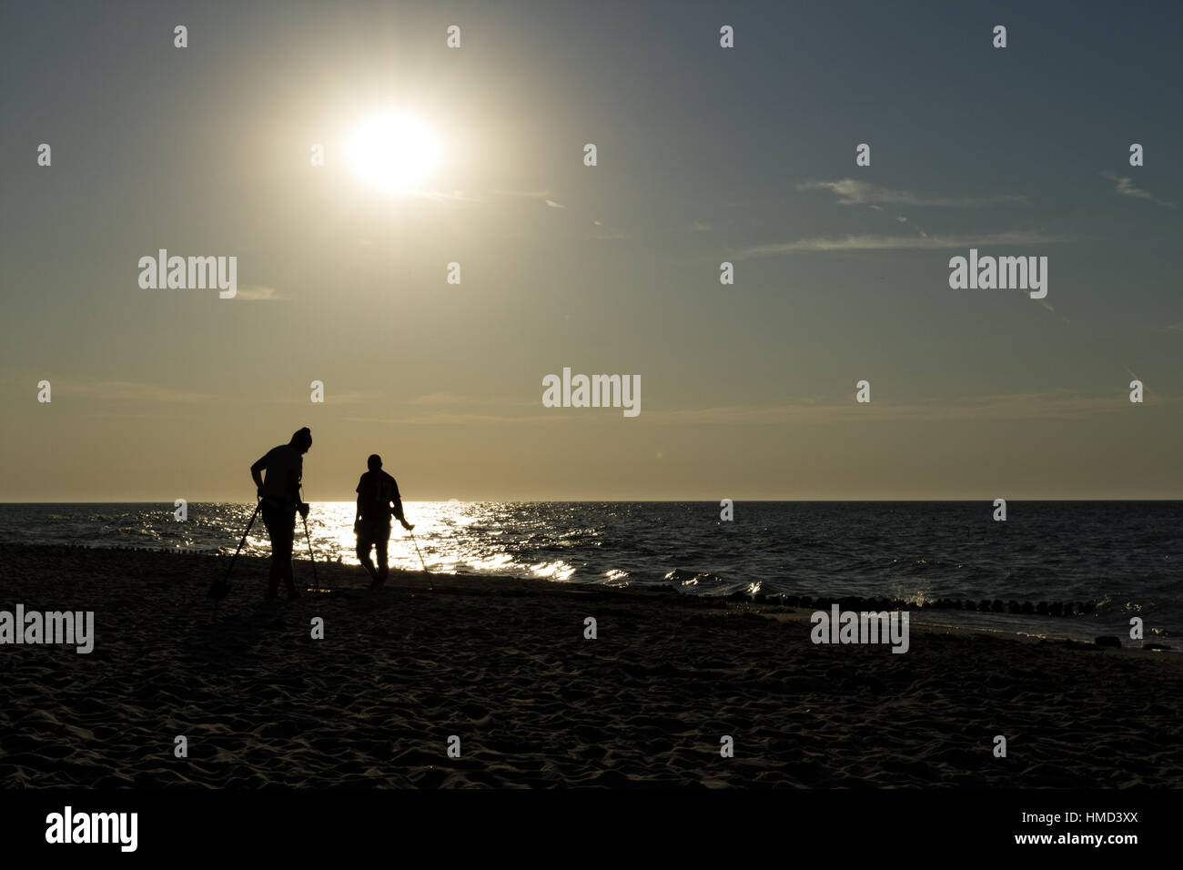 Two sappers searching for treasures on the beach Stock Photo