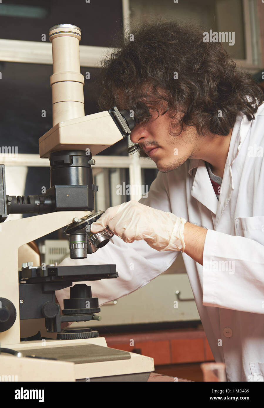 young man working in lab with microscope Stock Photo Alamy