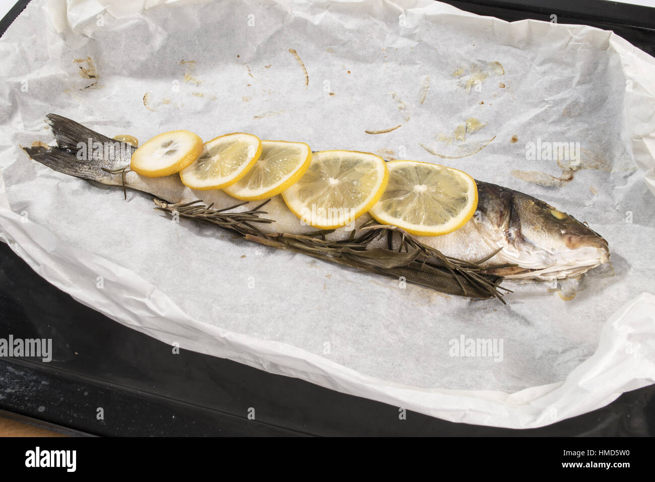 Sea bass baked in foil Stock Photo Alamy