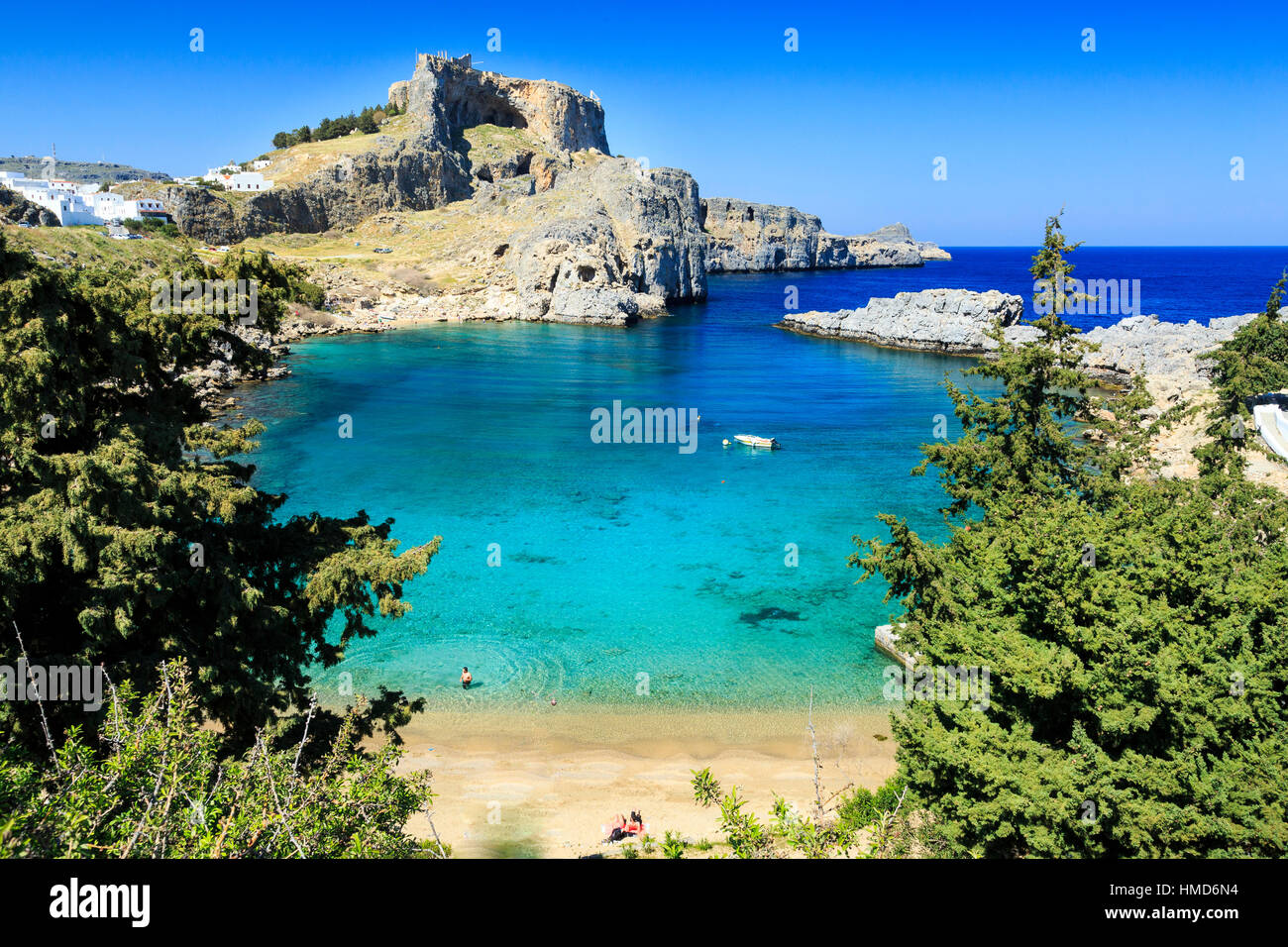 St Pauls Bay and Beach with Lindos Acropolis in the background, rhodes ...